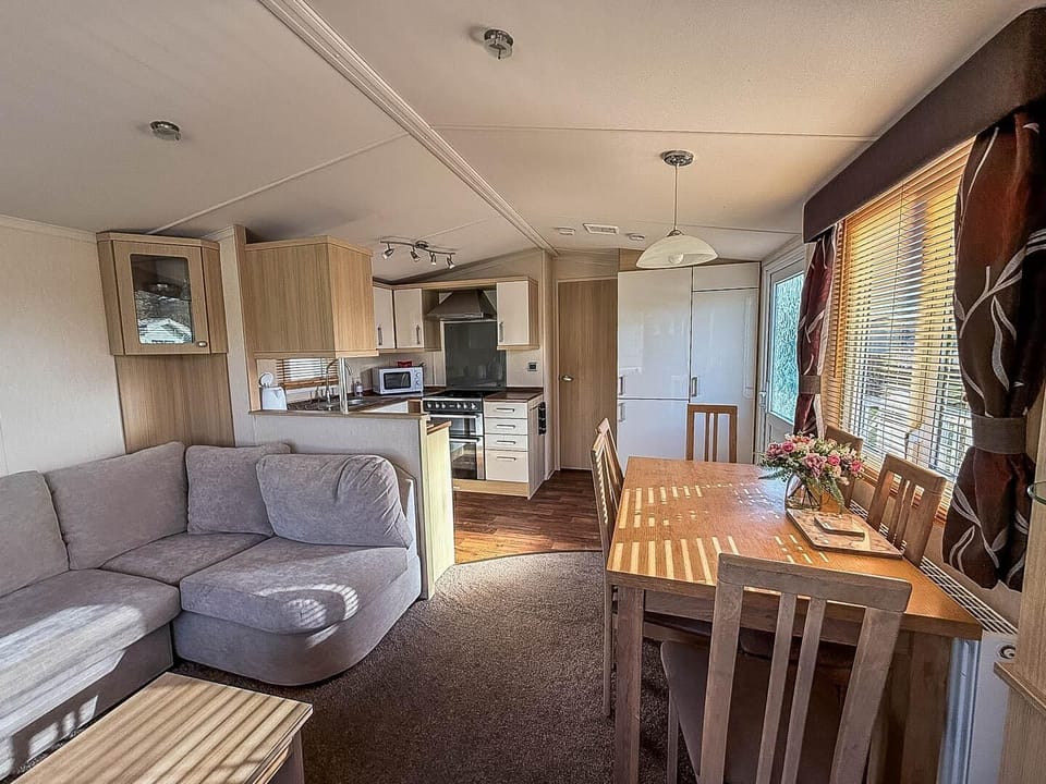 The base of this classic caravan is its wonderfully spacious open-plan lounge and dining area, designed for connection and comfort.