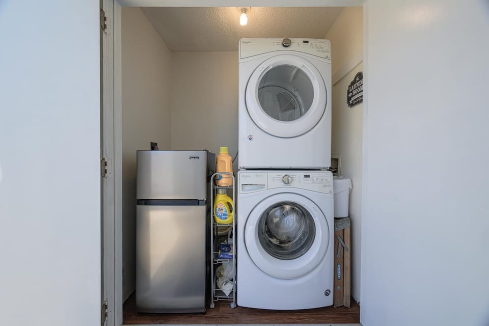Full size stackable washer/dryer and mini fridge.