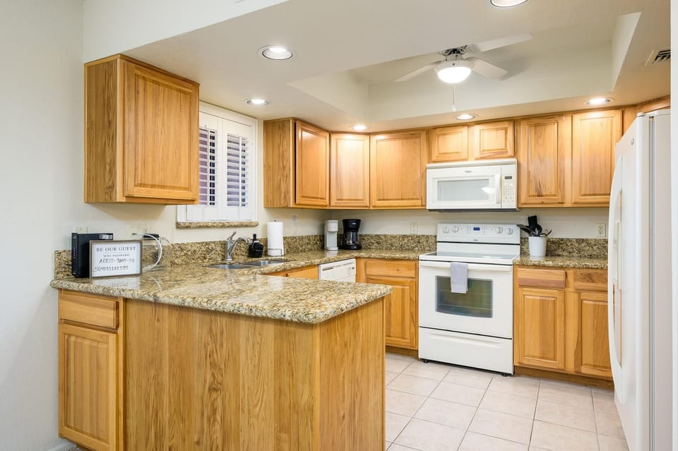 Granite countertops in fully stocked kitchen