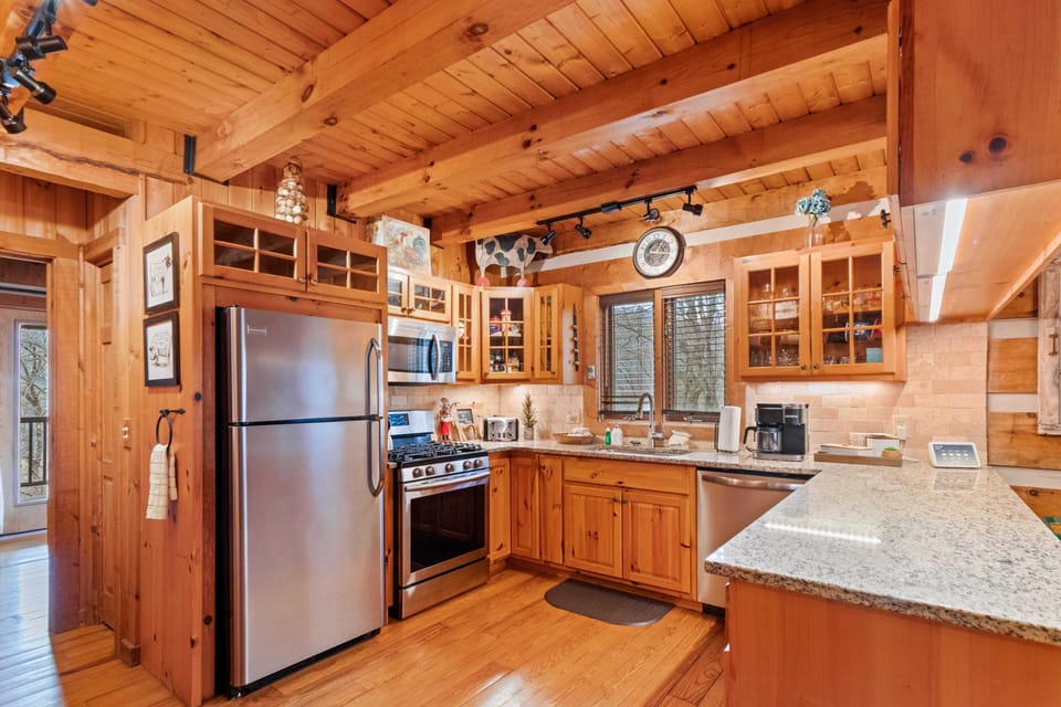 Kitchen has Granite Counter and Stainless Appliances