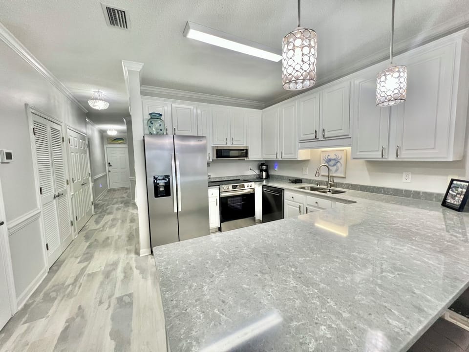 fully stocked kitchen with large countertop for all of your cooking needs