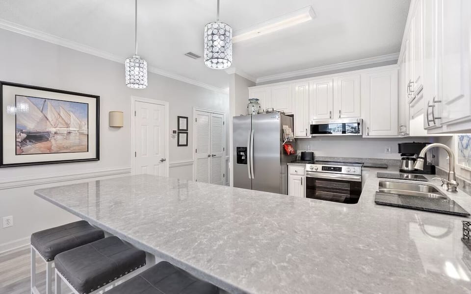 updated lighting, countertops, sink, fixtures and new stainless appliances