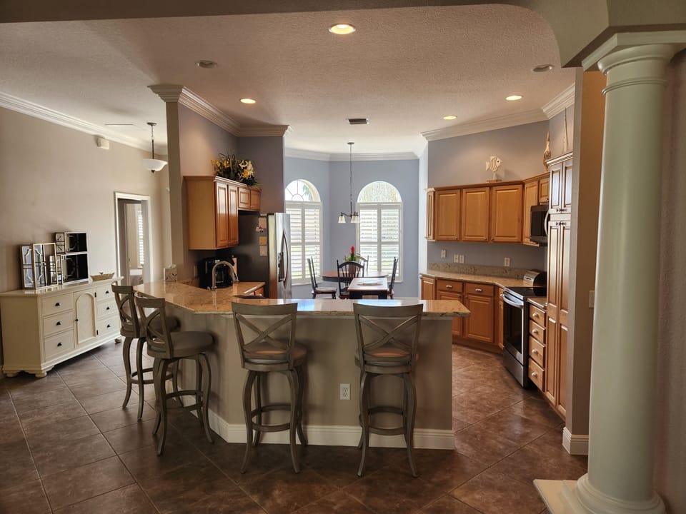 View from dining room to kitchen.  Bar height seating for 4.