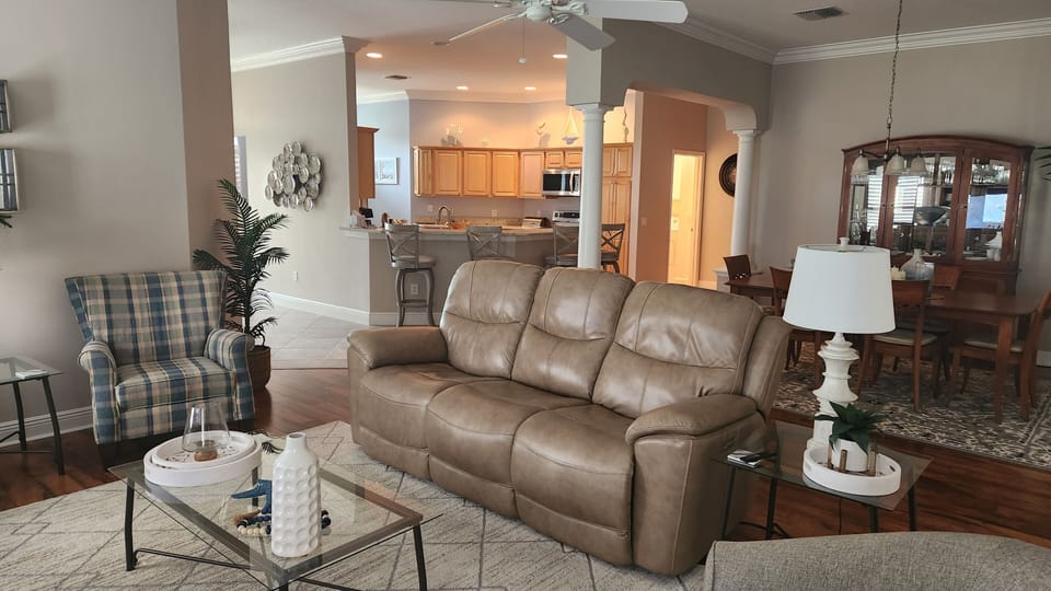 Leather sofa with dual reclining ends.