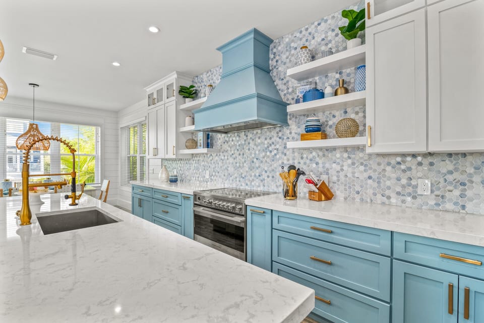 Chefs will love this vantage point — the island looks toward stainless appliances and plentiful prep space.