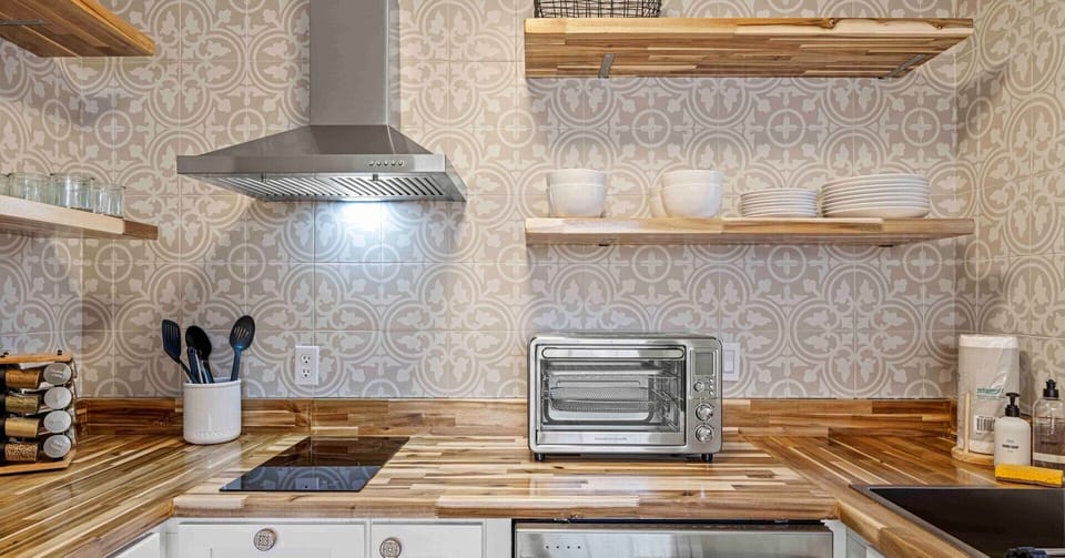 Fully equipped with modern appliances and plenty of counter space.