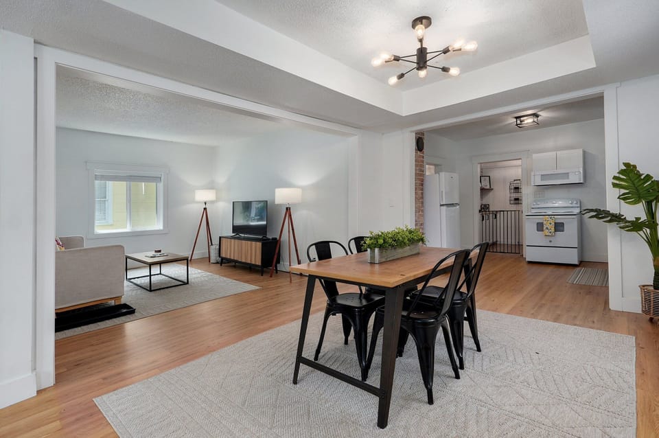 Table can seat up to 6 people with additional chairs in the bedrooms.