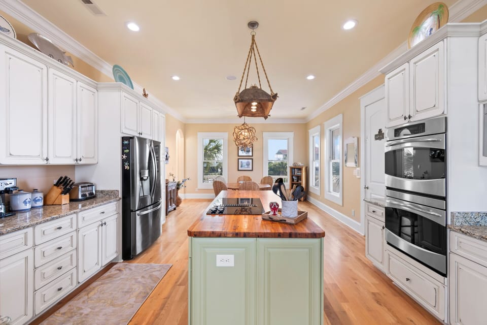 Your gourmet kitchen awaits with granite countertops, stainless appliances, and a beautiful island for cooking memorable vacation meals together.