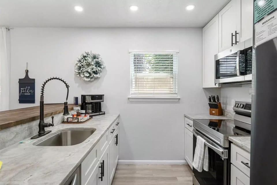 Updated kitchen equipped with stylish stainless steel appliances