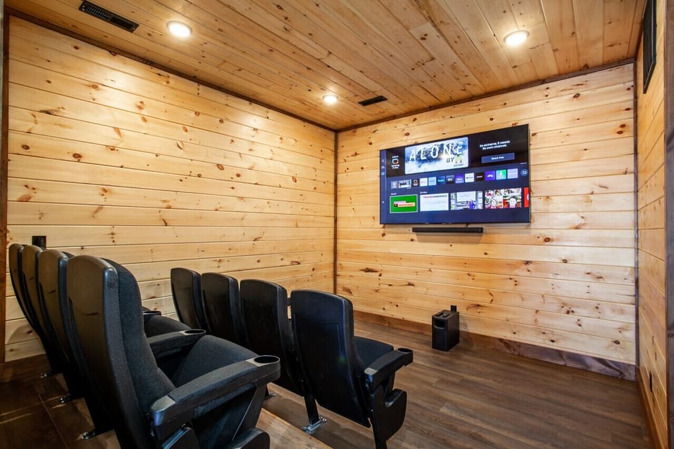 This private theater offers a unique blend of cozy comfort and cinematic quality, making it the perfect feature for a family retreat or mountain getaway.