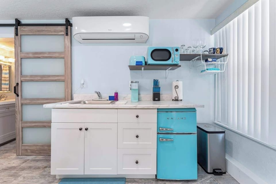 Kitchenette in the suite has a mini fridge, microwave, toaster, Keurig, sink, and a trash can. A small toaster oven is available too.
