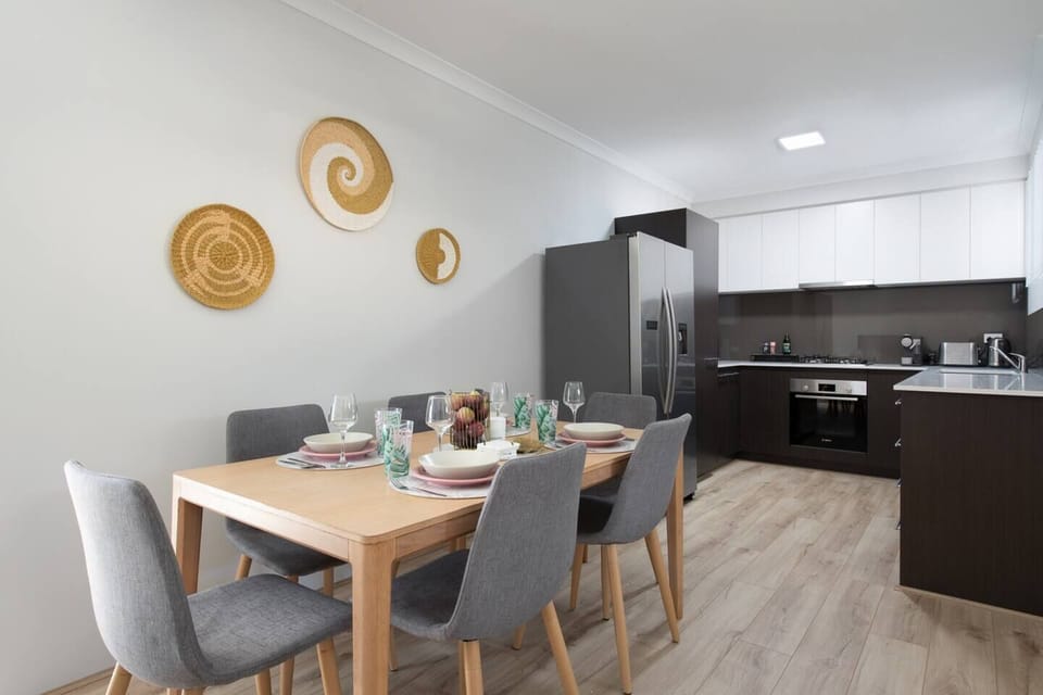 Gather around our stylish six-seater dining table. A sleek, well-appointed kitchen with all the essentials is just steps away.
