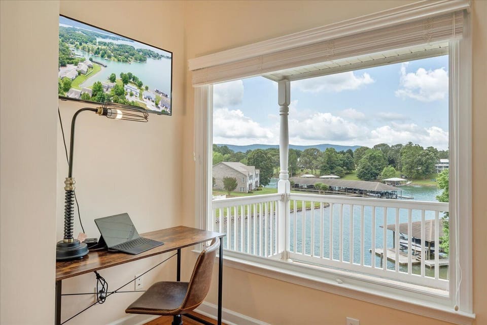 Work with a view! This third-floor office features a desk, chair, and stunning lake views for the perfect blend of productivity and tranquility.