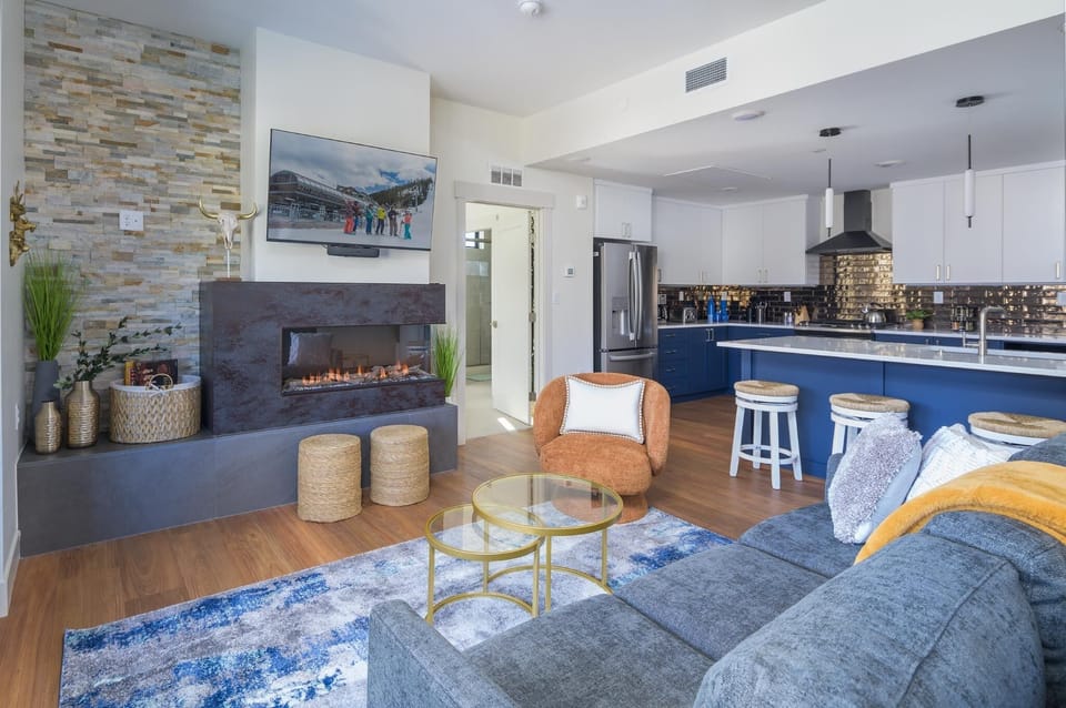 The living area leads into the kitchen