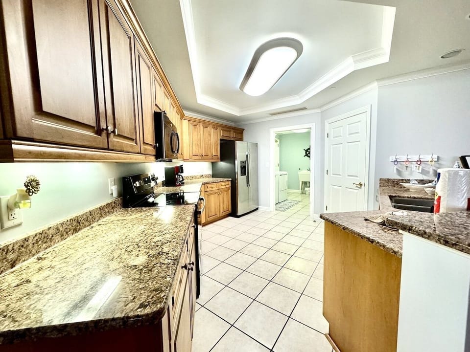 Beautiful granite countertops, solid wood cabinetry and a large pantry.