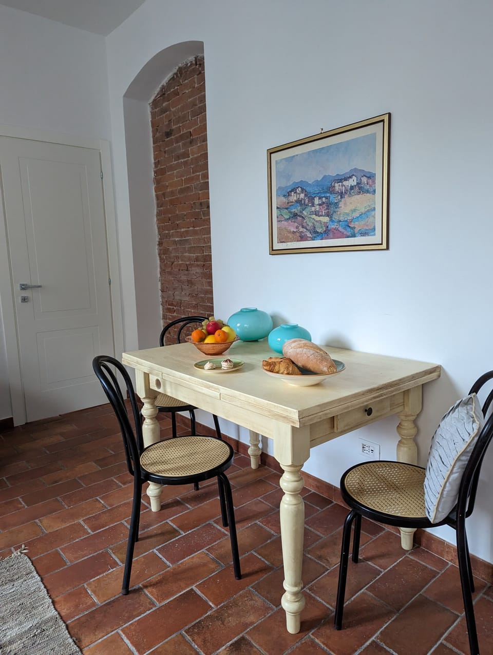 The kitchen table is expandable on both ends to accommodate up to eight people.