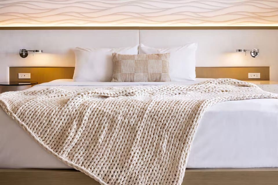 Sink into plush pillows and textured throws for deep sleep.