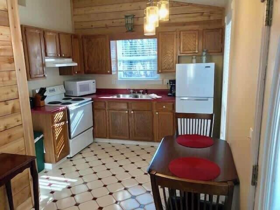 Full kitchen with dining area.