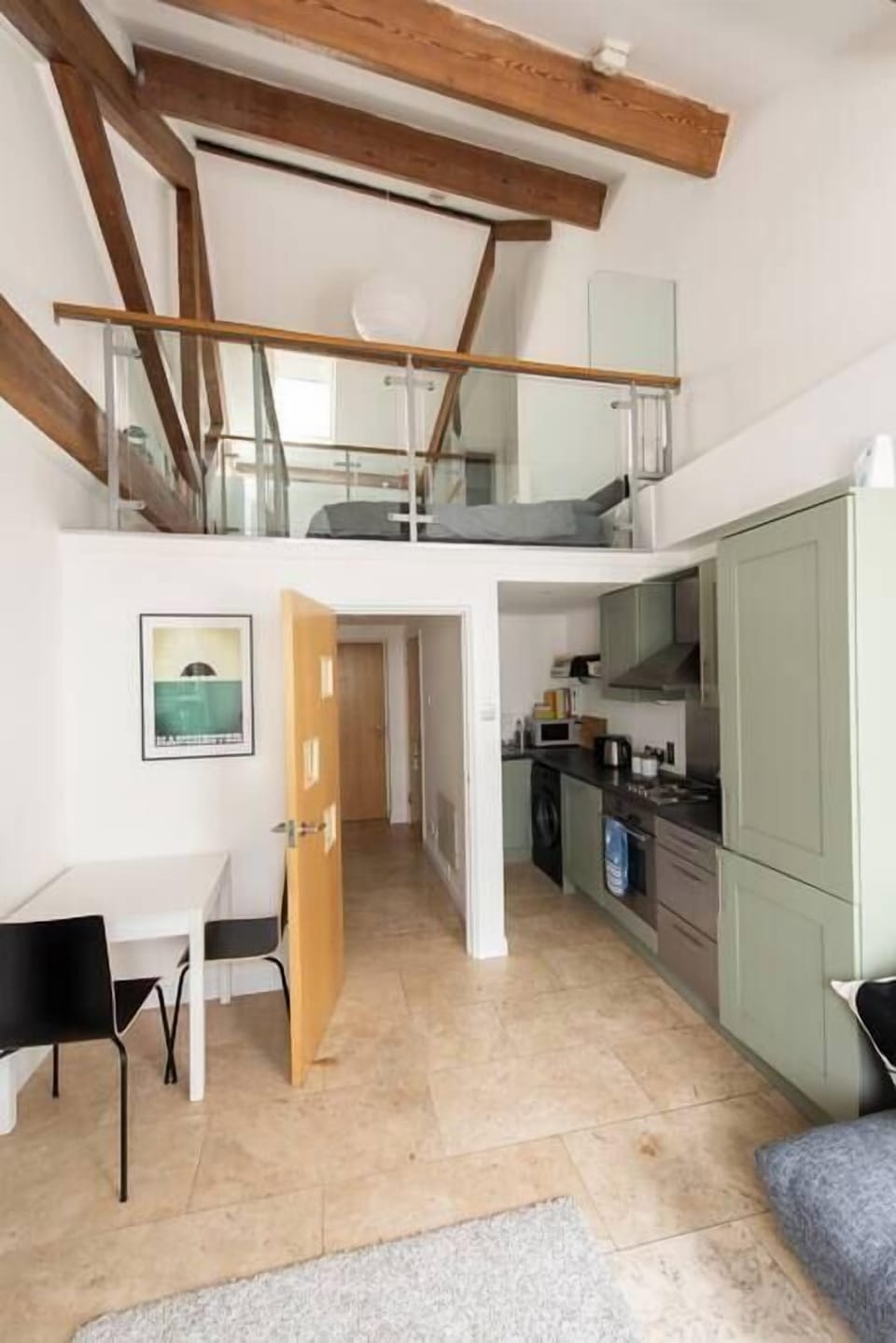 Clever stairs lead up to the upper sleeping level, making the most of this unique warehouse conversion