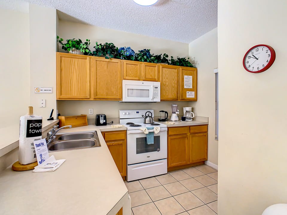 Fully equipped kitchen with modern appliances and ample counter space.