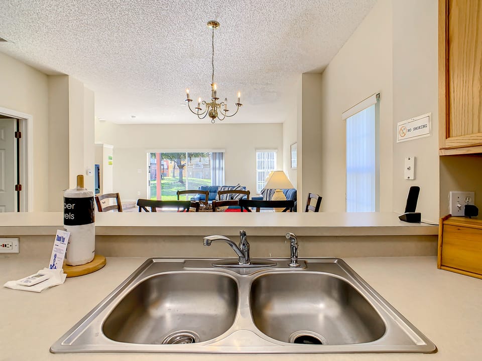 Spacious double sink with a view of the dining and living area.
