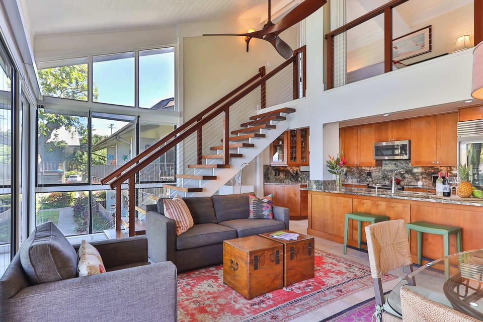 Open-concept living space with soaring ceilings, modern kitchen, and stylish décor. Reference "elegant" in your inquiry and get 5% off the nightly rate through December 20th of 2025.