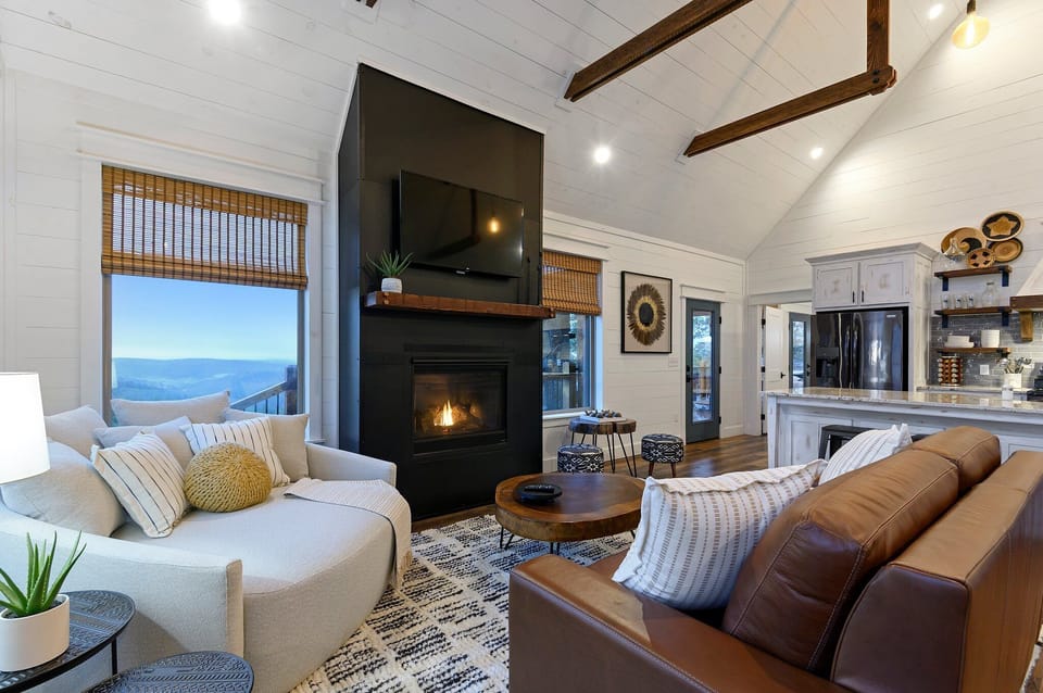 A Queen Sleeper Sofa, oversized couch and gas fireplace.