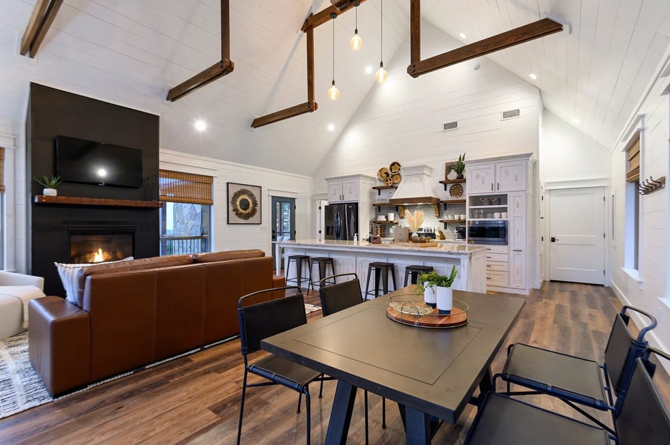 A wide-view of the living room, dining area and kitchen
