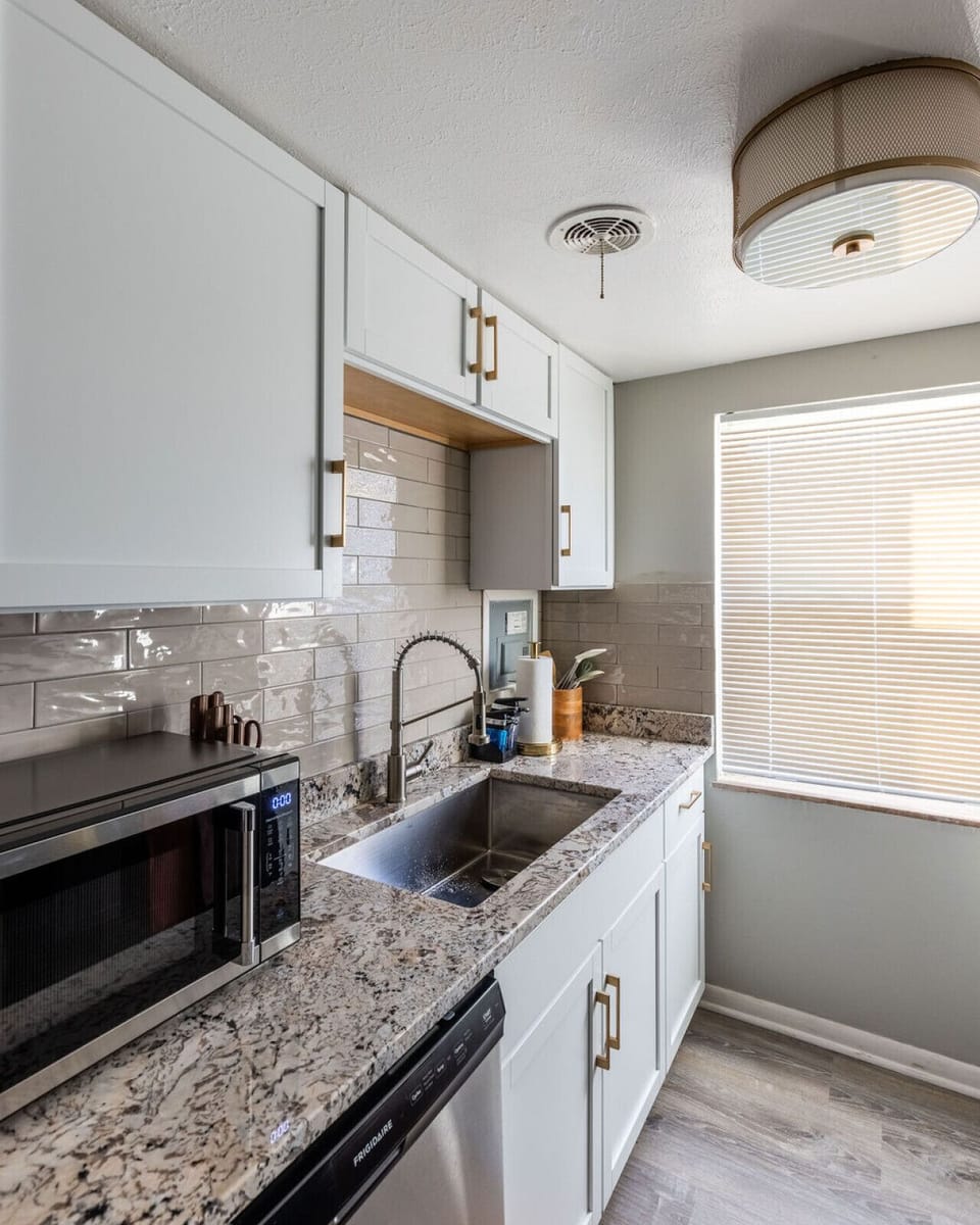 Prepare  your favorite meals in this tidy kitchen