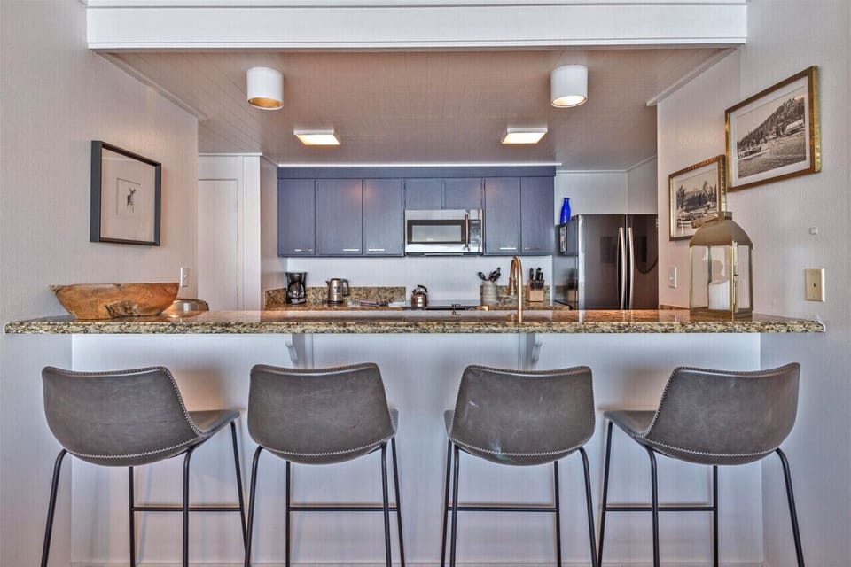 4 comfortable bar stools at the bar height counter in kitchen.