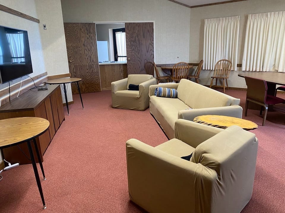 Dining room includes "hang-out" space with a piano, movies and games.