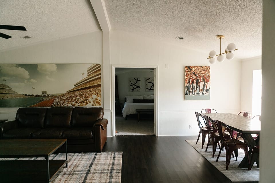 1 of 2 Living and Dining areas. 55" Smart TV. Table seats 8-12. Master attached.