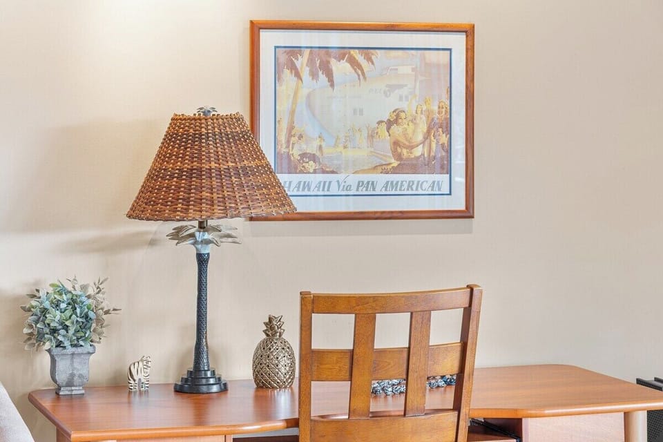 Dedicated workspace with desk and lighting, ideal for remote work while staying connected in a tranquil island setting.
