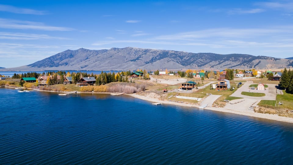 Step from your back door to the private boat dock at Henry's Hatch Cabin, offering instant access to Henry's Lake for endless water adventures and tranquil moments on the water.
