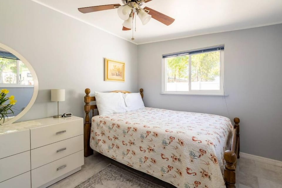 In the embrace of a serene bedroom, unwinding after a long day unfolds. The atmosphere whispers comfort and rejuvenation, providing a perfect retreat from the day's demands.