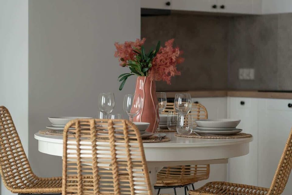 A spacious underground parking garage with well-marked parking spaces, bright lighting, and a clean, organized layout.






