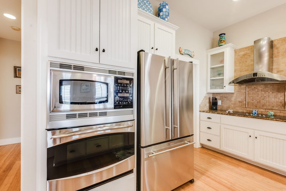 Your fully equipped kitchen features stainless steel appliances and granite countertops, perfect for preparing meals during your stay.