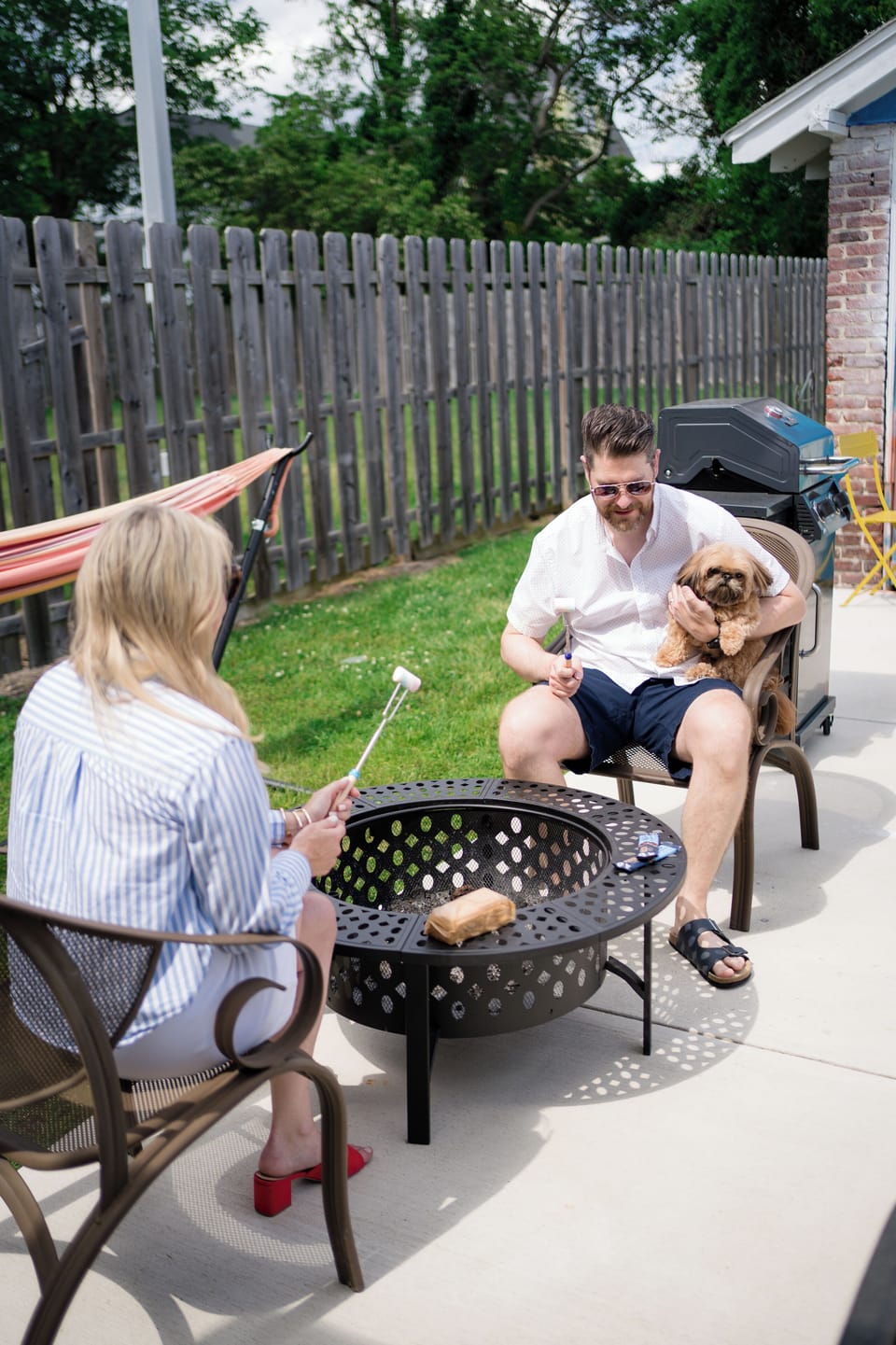 Create unforgettable moments in our backyard featuring a firepit, hammock, BBQ 