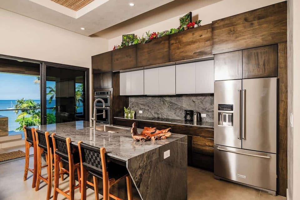Sip coffee with ocean views, then gather for gourmet delights.

