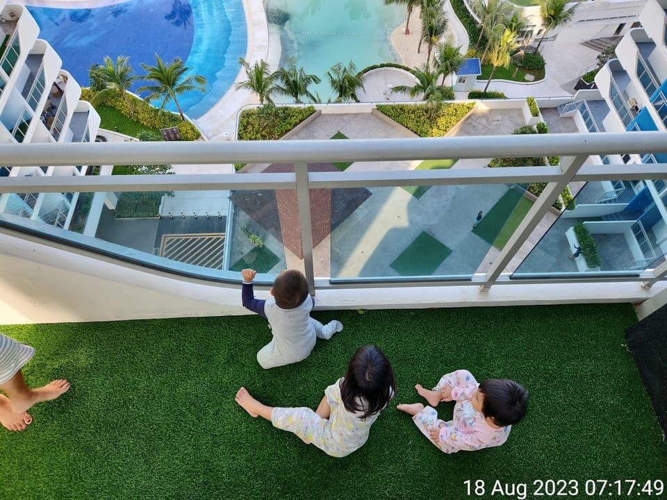 View from our unit Balcony to Amenities Wavepool, White Sand Beach & Club House