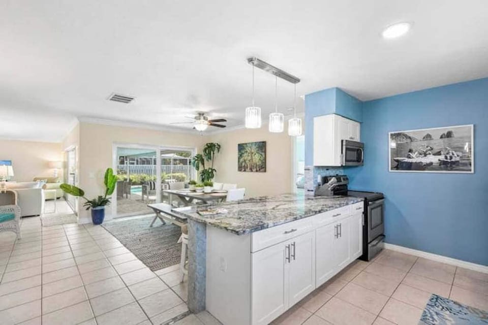 View from the kitchen into the dining and great room space 