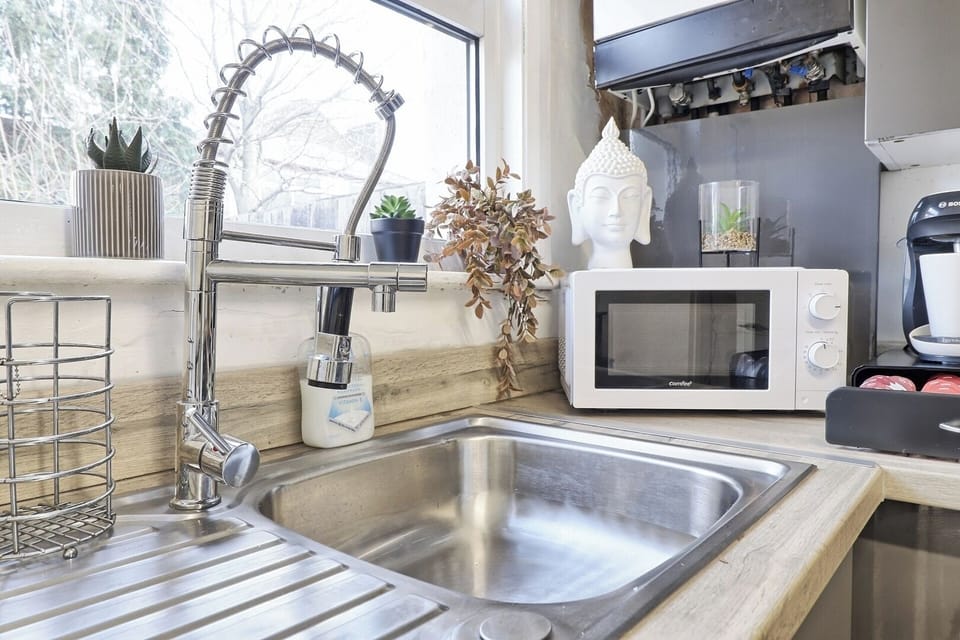 The modern kitchen is decorated in a soothing, zen-like style. You will find this kitchen to be ideal for preparing meals or quickly making cupper!
