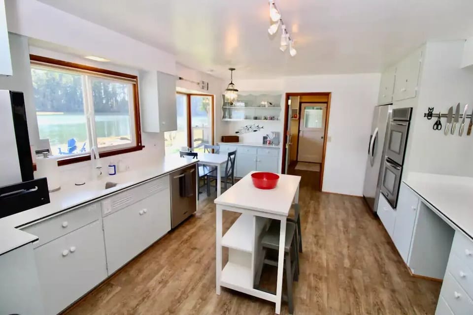 Island with seating for 2 and a table with seating for 3. 