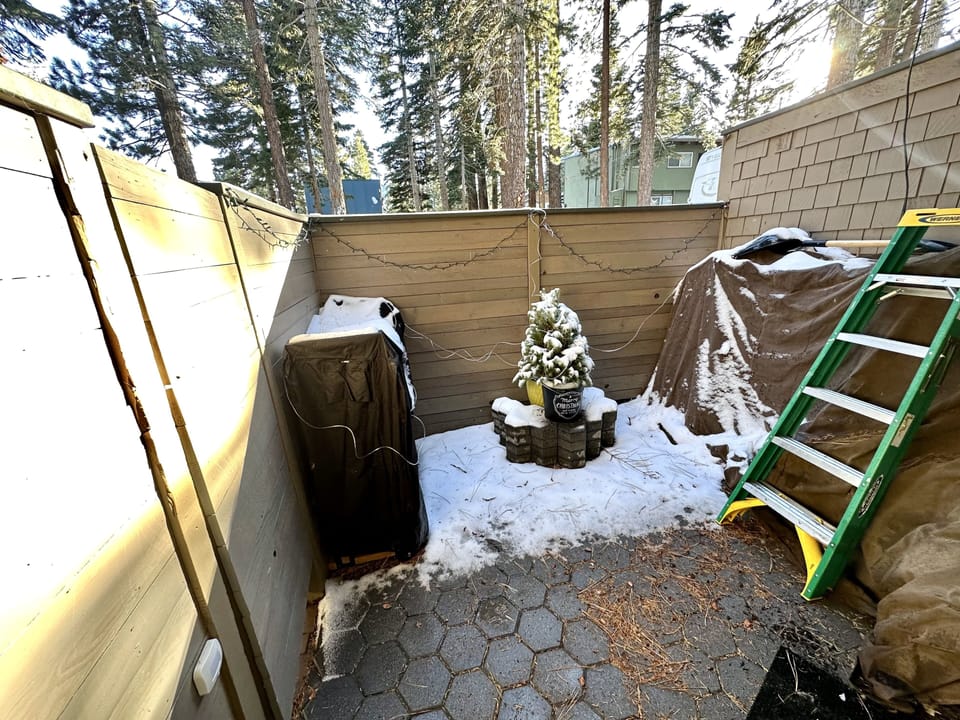 Private patio off bedroom 1; ski/equipment storage area.
