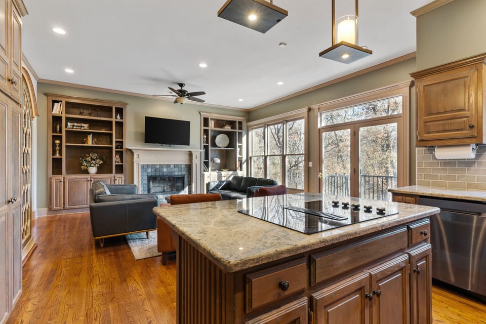 Open concept kitchen with views of the main living room, and the quite private outdoor space. 