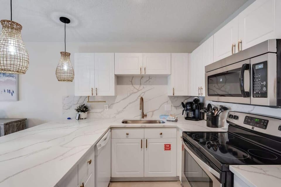 - Fully equipped kitchen with modern appliances and plenty of prep space - Brew coffee, cook breakfast, or reheat leftovers with ease and style - Clean lines, sleek finishes, and thoughtful touches make cooking a breeze
