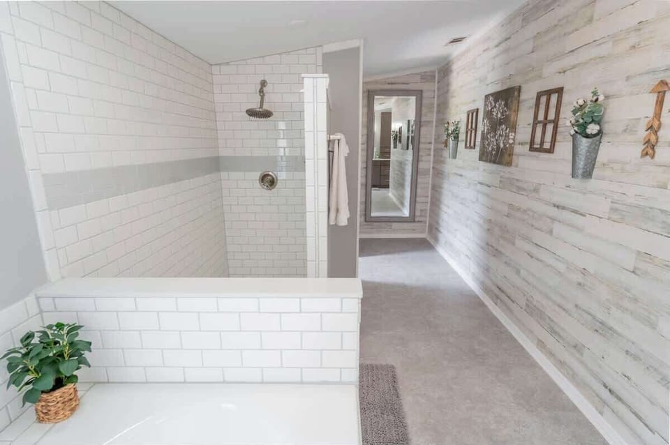 In the main bathroom off of the king-size room is an oversized walk-in shower & enclosed toilet area.