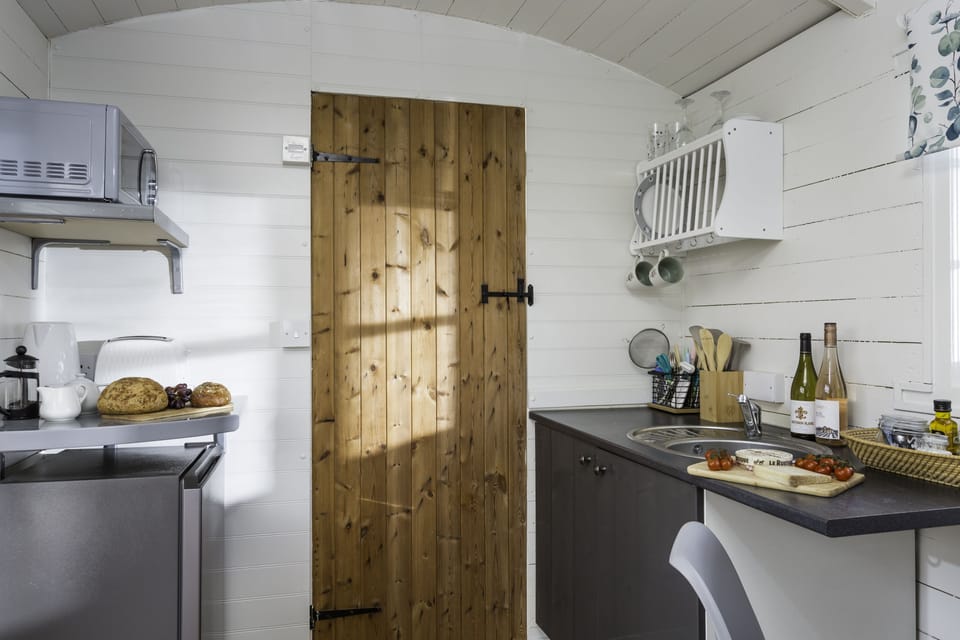 Well-equipped kitchen with an electric frying pan and Russell Hobbs airfryer