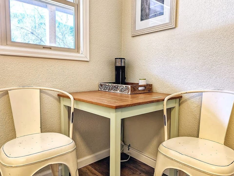  Coffee setup and small table seating, useful for morning routines or light laptop time.
