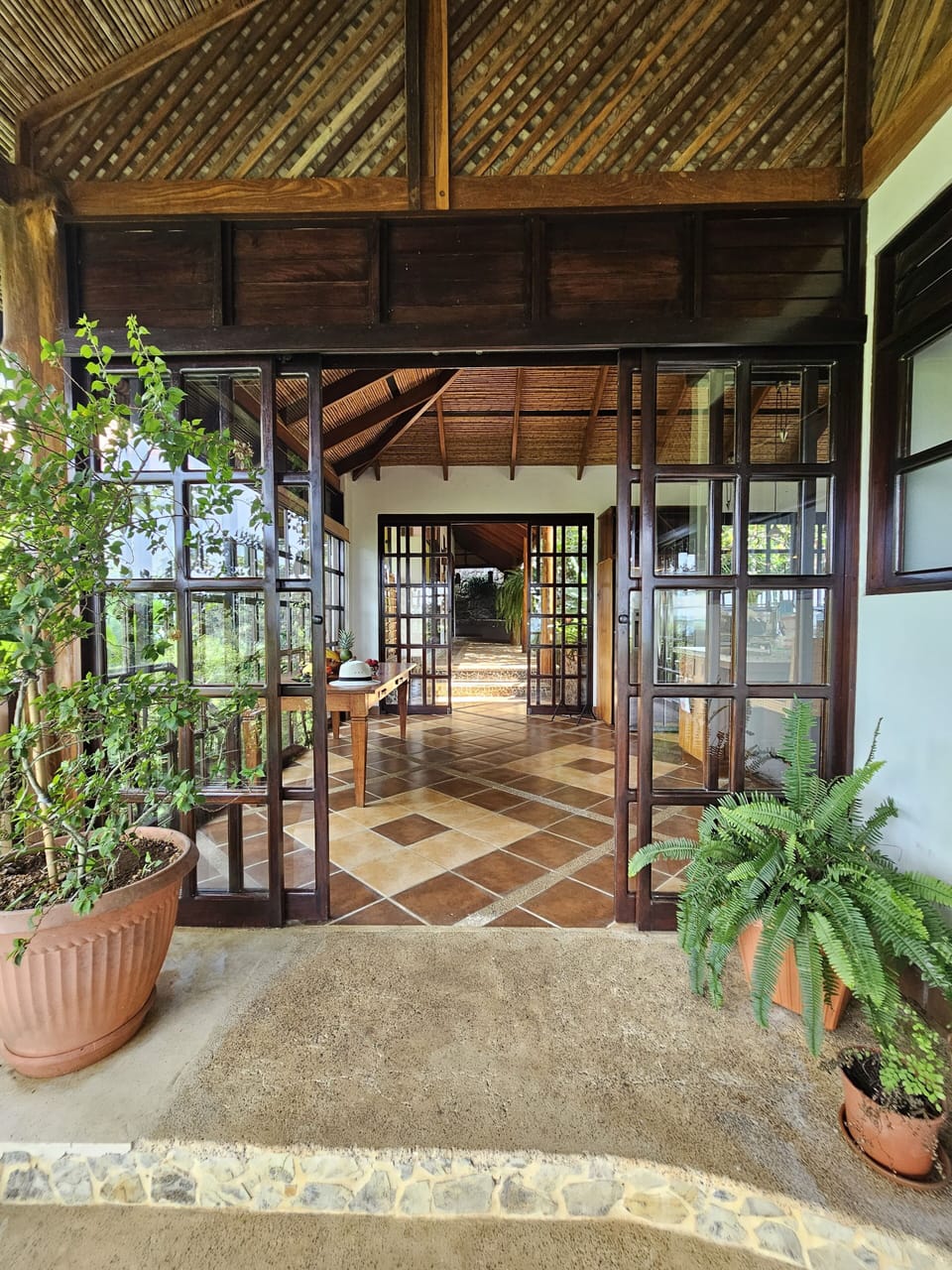 View from the side patio off the casa living room through to the bedroom wing